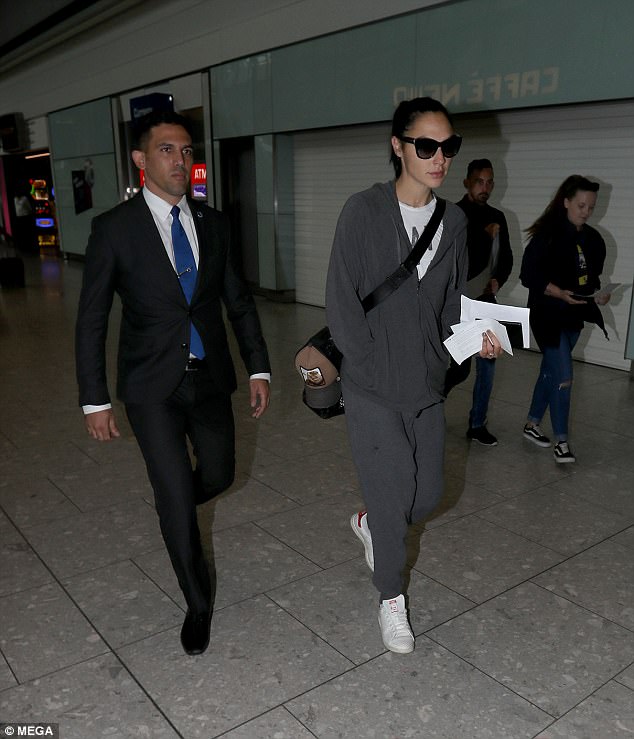 To cape it all off! Wonder Woman star Gal Gadot goes make-up free and wears baggy grey sweatshirt as she lands in London ahead of Comic-Con